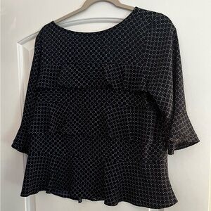 Ann Taylor ruffled top. Three-quarter length sleeves; black & navy print. Size M
